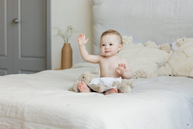 Baby Sitting on Bed